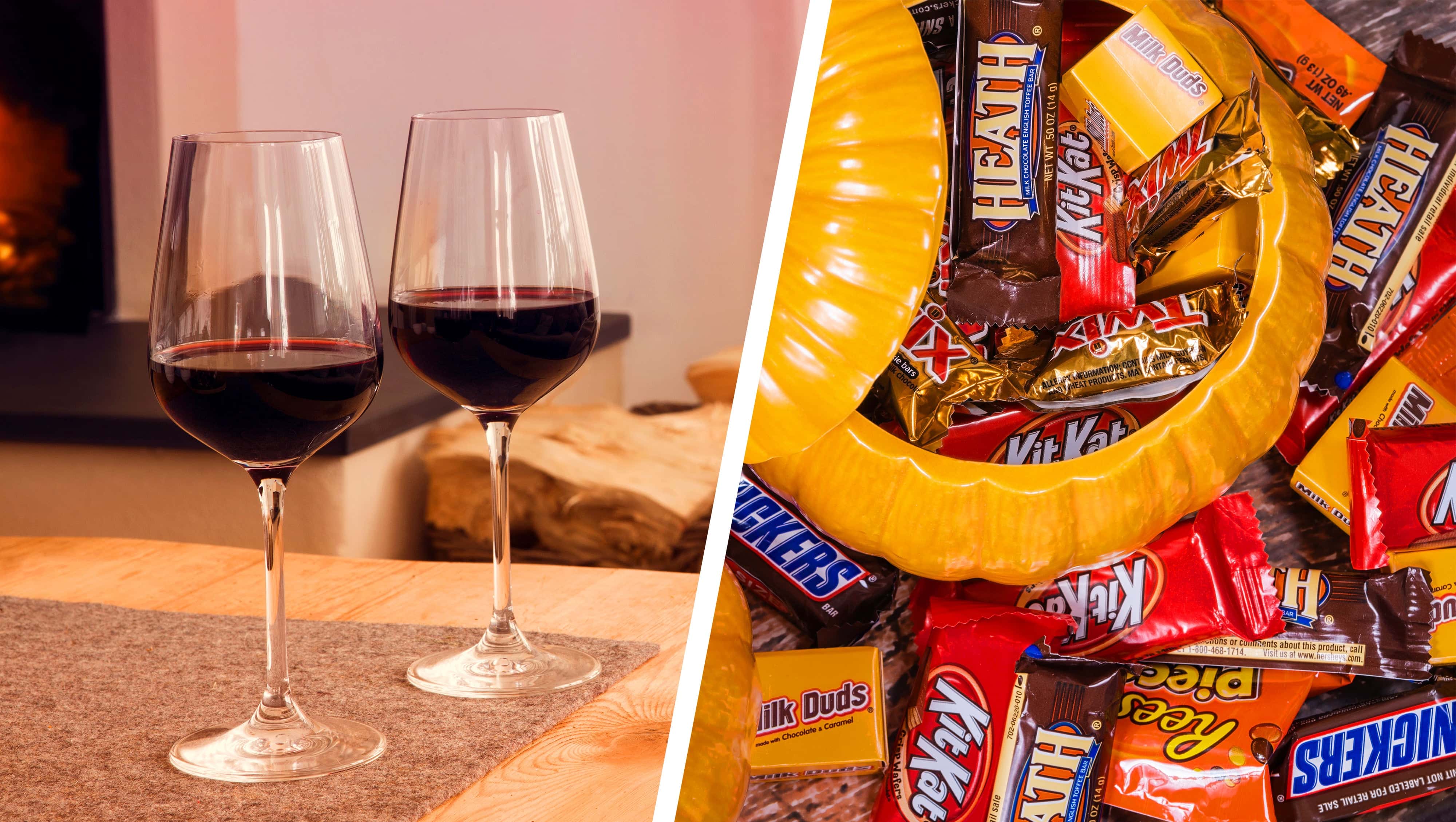 Split image showing two glasses of red wine on a table beside a cozy fireplace, paired with a bowl of assorted Halloween candies including Kit Kat, Snickers, and Milk Duds.