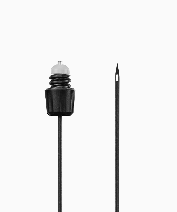Black Coravin needle needle and black plunger assembly, side-by-side, with a clear top cap on the plunger.
