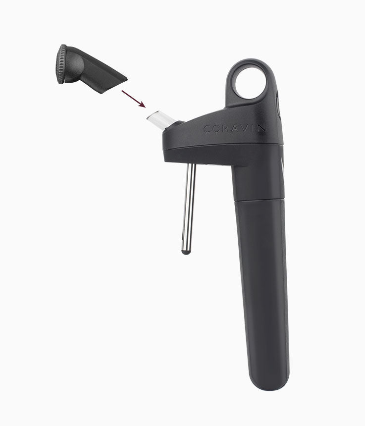Coravin wine opener with a removable top, featuring a needle for pouring wine without cork damage.