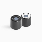 Two Coravin wine capsule tops with a black and white color scheme, featuring the Coravin logo on each.